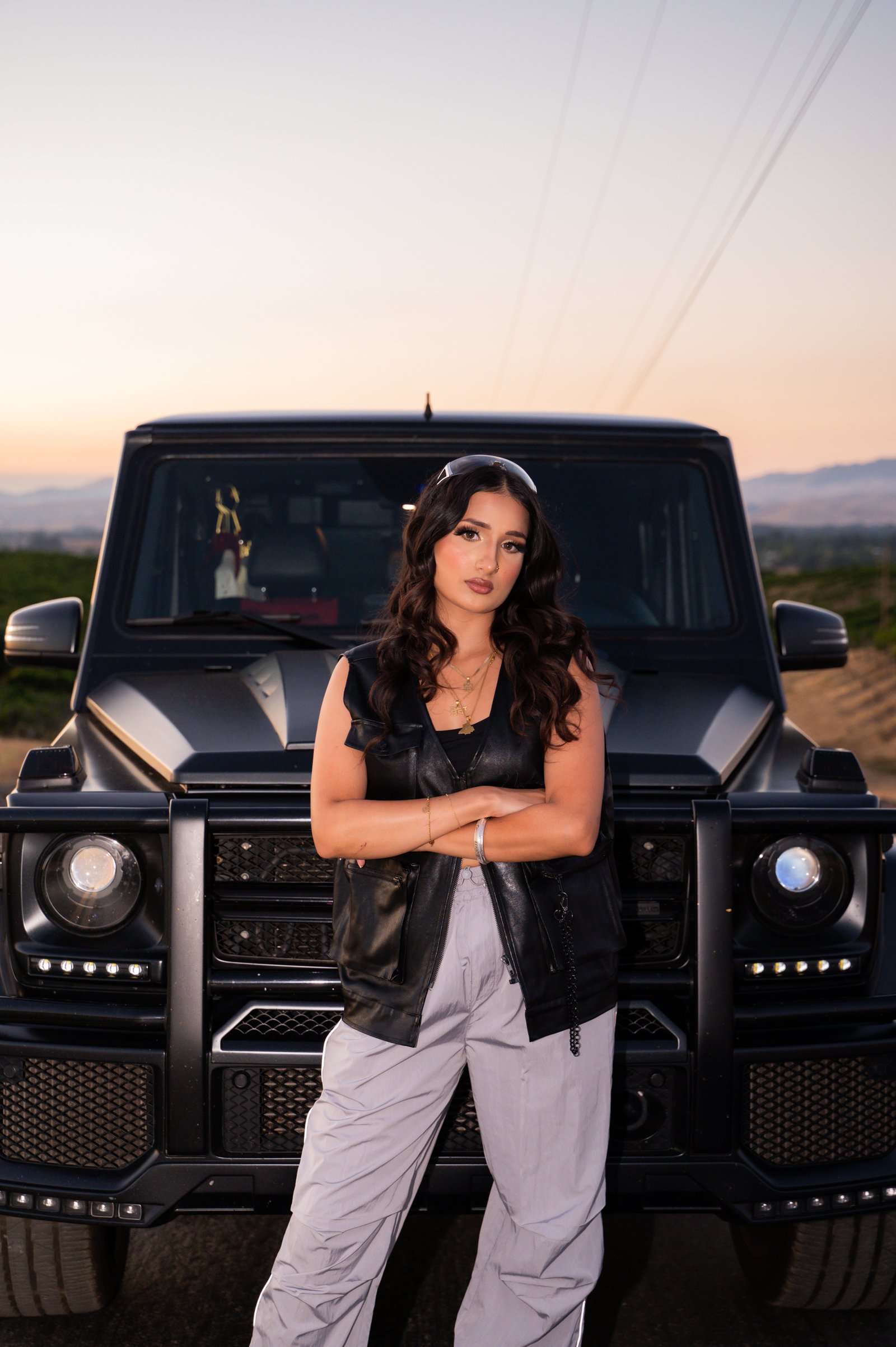 Portrait photo of girl in front of G-Wagon